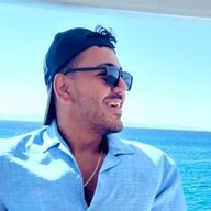 Tariq, smiling, on a boat